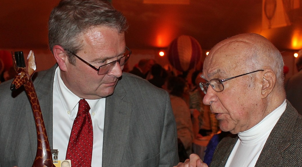 <b>Bob Aitchison</b> holding the TWIGA award and speaking with Dr. George Rabb. - Bob-Aitchison-with-Dr.-George-Rabb-4-27-2014-1038x576