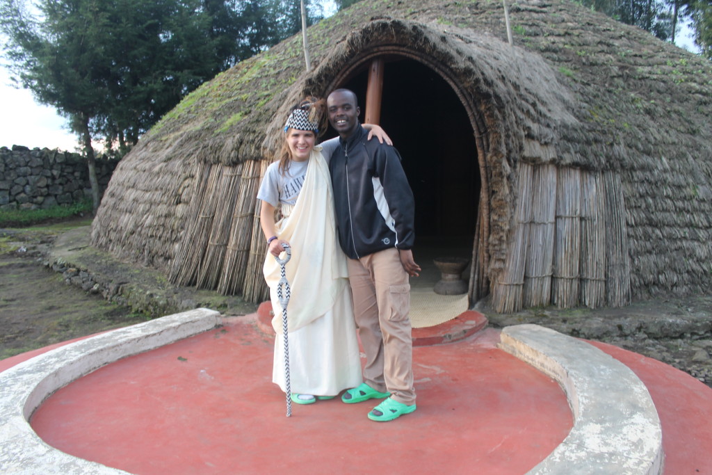 In traditional clothing in front of King's Hut with her friend Cederick who "taught me everything". His grandparents & parents were poachers, but he is a conservationist!